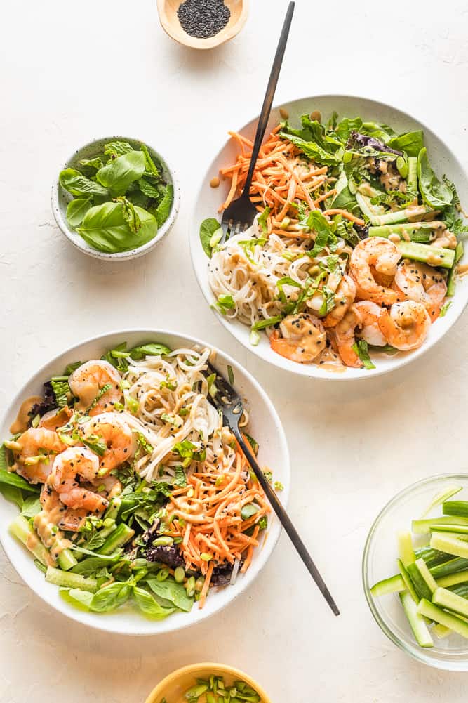 Spring roll bowls with shrimp and peanut dressing.