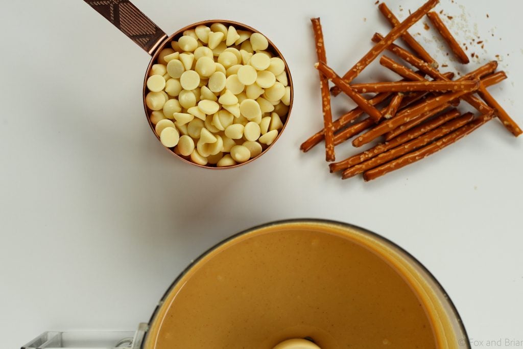 White Chocolate Pretzel Peanut Butter! This sweet treat is homemade peanut butter with white chocolate and pretzels mixed in.