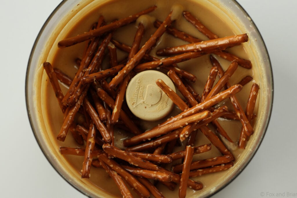 White Chocolate Pretzel Peanut Butter! This sweet treat is homemade peanut butter with white chocolate and pretzels mixed in.