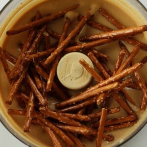 This sweet treat is homemade peanut butter with white chocolate and pretzels mixed in.