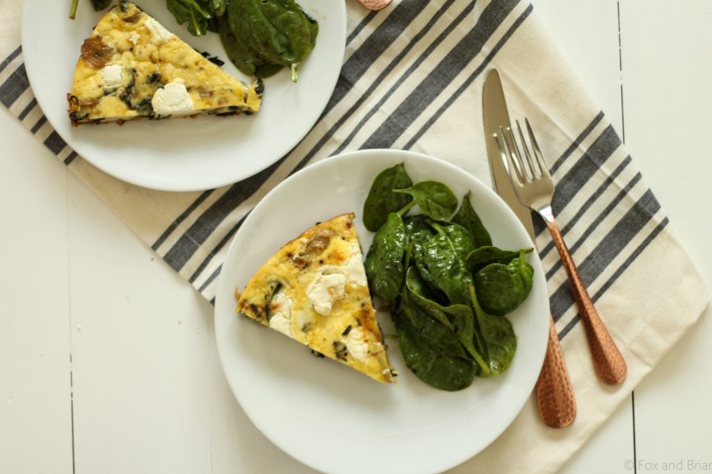 This savory frittata gets lots of flavor from caramelized onions, goat cheese and crispy kale! Vegetarian and gluten free!