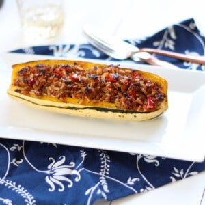 This Stuffed Delicata Squash Recipe is uses chicken sausage and is so flavorful
