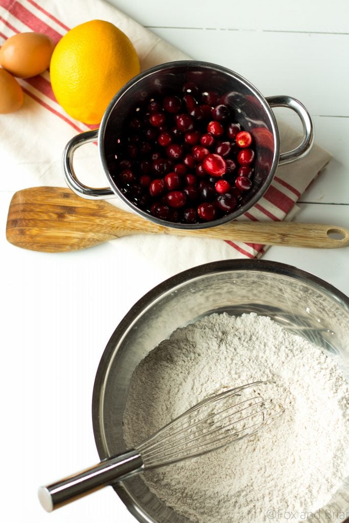 Looking for a way to use up your leftover cranberry sauce? These Leftover Cranberry Sauce Muffins are just the thing! Hints of orange zest, tart cranberries and a brown sugar crumble topping will make these the perfect breakfast the day after Thanksgiving! |Cranberry orange muffins | Leftover cranberry sauce recipes | strudel topping for muffins | thanksgiving leftover recipes