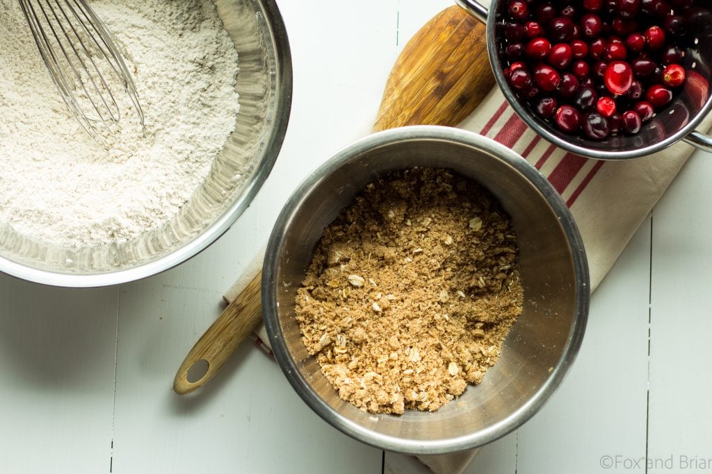 Looking for a way to use up your leftover cranberry sauce? These Leftover Cranberry Sauce Muffins are just the thing! Hints of orange zest, tart cranberries and a brown sugar crumble topping will make these the perfect breakfast the day after Thanksgiving! |Cranberry orange muffins | Leftover cranberry sauce recipes | strudel topping for muffins | thanksgiving leftover recipes