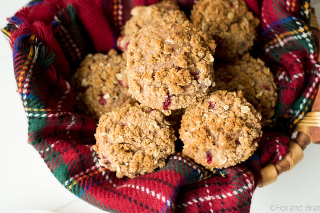 Looking for a way to use up your leftover cranberry sauce? These Leftover Cranberry Sauce Muffins are just the thing! Hints of orange zest, tart cranberries and a brown sugar crumble topping will make these the perfect breakfast the day after Thanksgiving! |Cranberry orange muffins | Leftover cranberry sauce recipes | strudel topping for muffins | thanksgiving leftover recipes