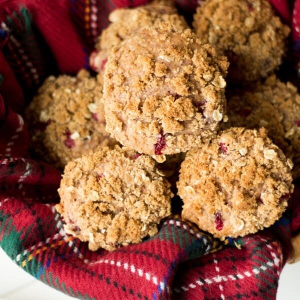 These muffins are super moist and made with cranberry sauce and fresh cranberries with hints or orange and brown sugar.