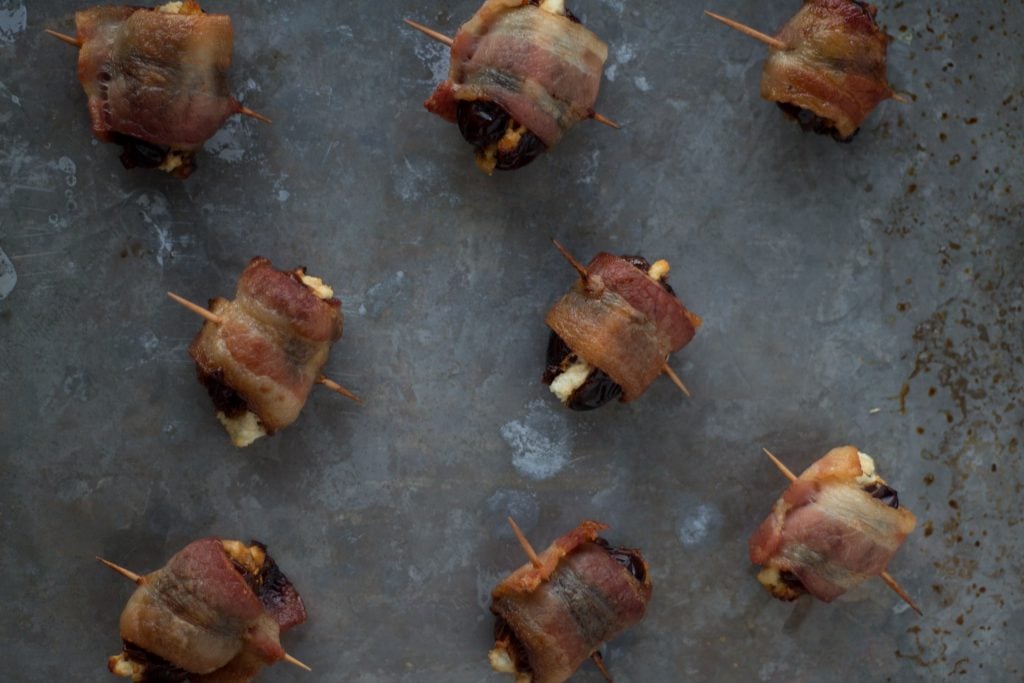 Goat Cheese Stuffed Bacon Wrapped Dates - these are so easy, only take 3 ingredients and are wildly addictive! They will dissapear before you know it.