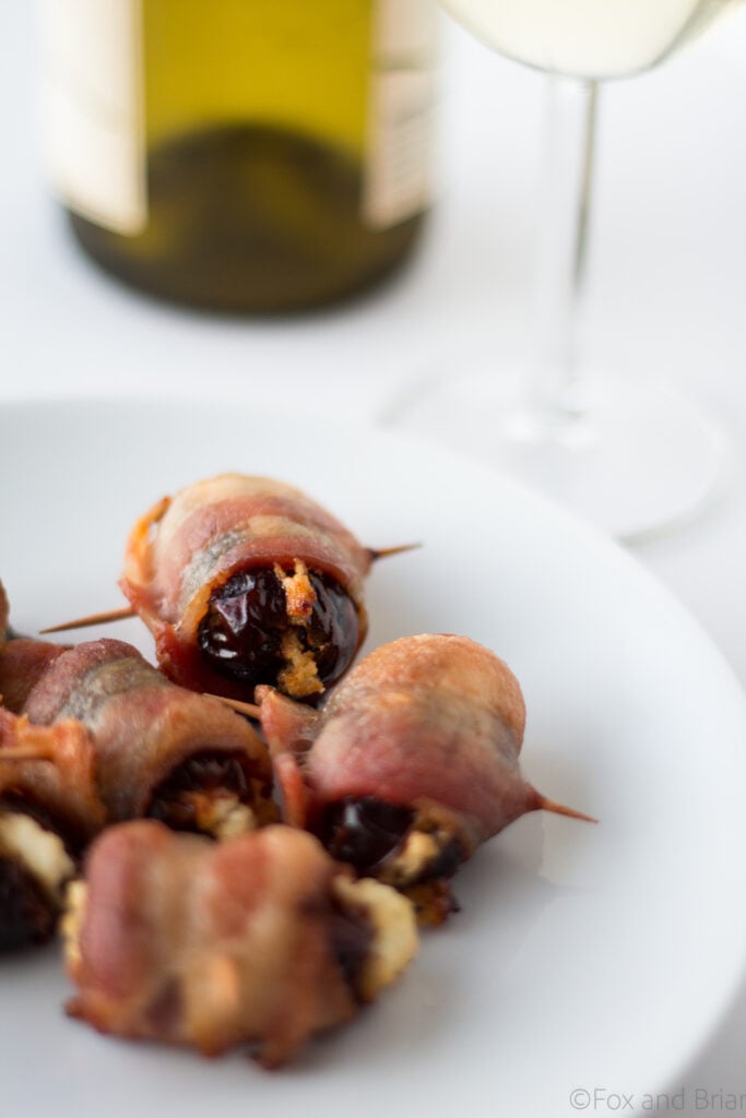 Goat Cheese Stuffed Bacon Wrapped Dates - these are so easy, only take 3 ingredients and are wildly addictive! They will dissapear before you know it.