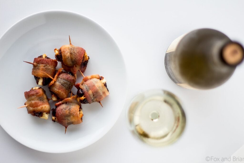 Goat Cheese Stuffed Bacon Wrapped Dates - these are so easy, only take 3 ingredients and are wildly addictive! They will dissapear before you know it.