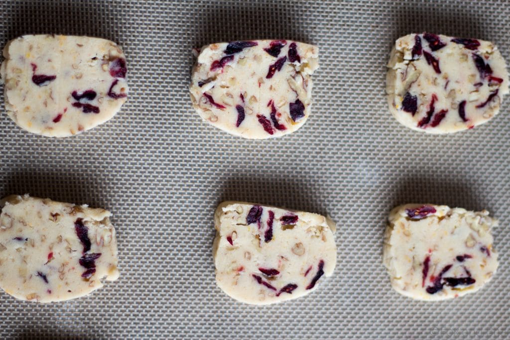 Cranberry Orange and Pecan Shortbread cookies. These easy, slice and bake cookies are flavored with orange zest, vanilla, cranberries and pecans. They are the perfect holiday cookies to give away or keep for yourself!