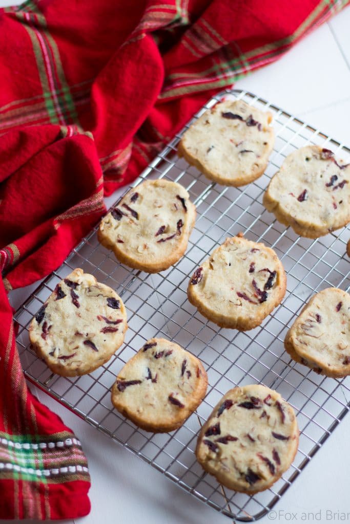 Cranberry Orange and Pecan Shortbread cookies. These easy, slice and bake cookies are flavored with orange zest, vanilla, cranberries and pecans. They are the perfect holiday cookies to give away or keep for yourself!