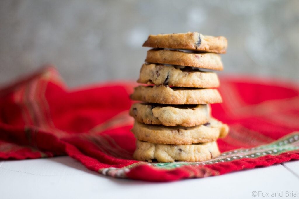 Cranberry Orange and Pecan Shortbread cookies. These easy, slice and bake cookies are flavored with orange zest, vanilla, cranberries and pecans. They are the perfect holiday cookies to give away or keep for yourself!