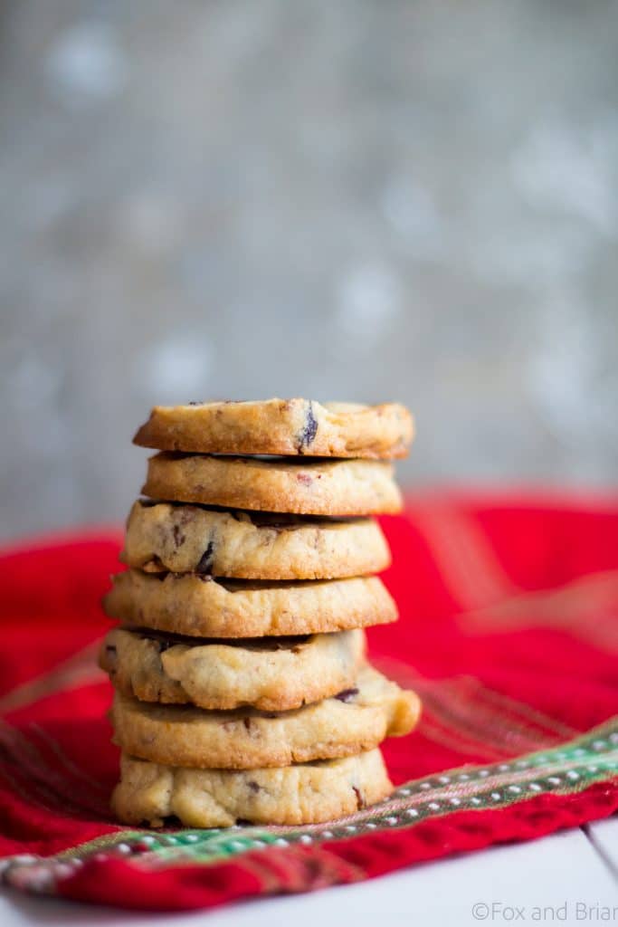 Cranberry Orange and Pecan Shortbread cookies. These easy, slice and bake cookies are flavored with orange zest, vanilla, cranberries and pecans. They are the perfect holiday cookies to give away or keep for yourself!