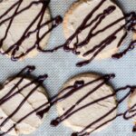 These buttery, delicate vanilla cookies are topped with a whipped peanut butter cream and then drizzled with a rich chocolate glaze.