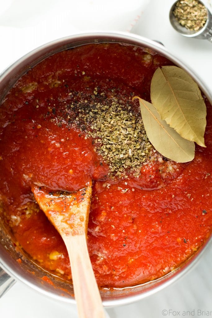 This super quick and easy classic marinara sauce takes twenty minutes to make, and uses pantry staples that you probably have on hand now. great for a weeknight meal with pasta, pizza or spaghetti squash!