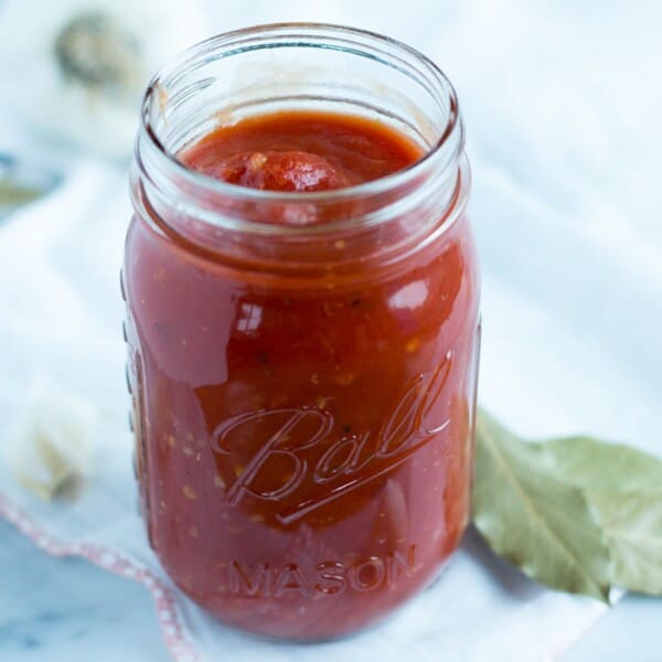 This super quick and easy classic marinara sauce takes twenty minutes to make, and uses pantry staples that you probably have on hand now. great for a weeknight meal with pasta, pizza or spaghetti squash!