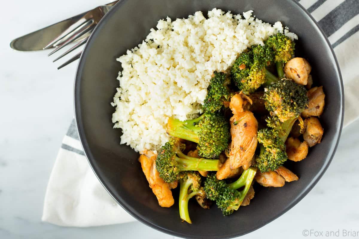 This Buffalo Chicken and Broccoli Bowl is fast, easy and flavorful. Chicken and broccoli in a buffalo sauce, served over cauliflower rice makes a gluten free, low carb, high protein, paleo and whole 30 friendly meal!