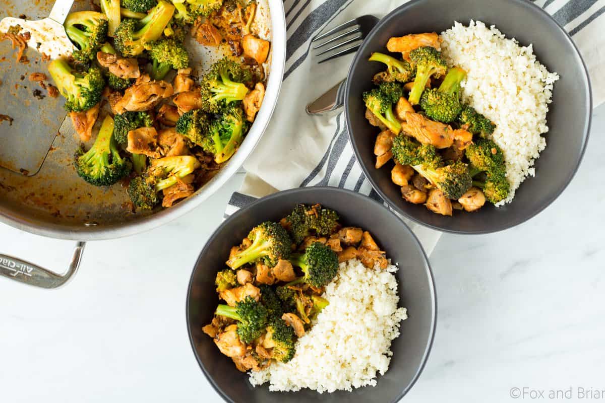 This Buffalo Chicken and Broccoli Bowl is fast, easy and flavorful. Chicken and broccoli in a buffalo sauce, served over cauliflower rice makes a gluten free, low carb, high protein, paleo and whole 30 friendly meal!