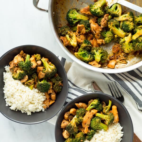 This Buffalo Chicken and Broccoli Bowl is fast, easy and flavorful. Chicken and broccoli in a buffalo sauce, served over cauliflower rice makes a gluten free, low carb, high protein, paleo and whole 30 friendly meal!