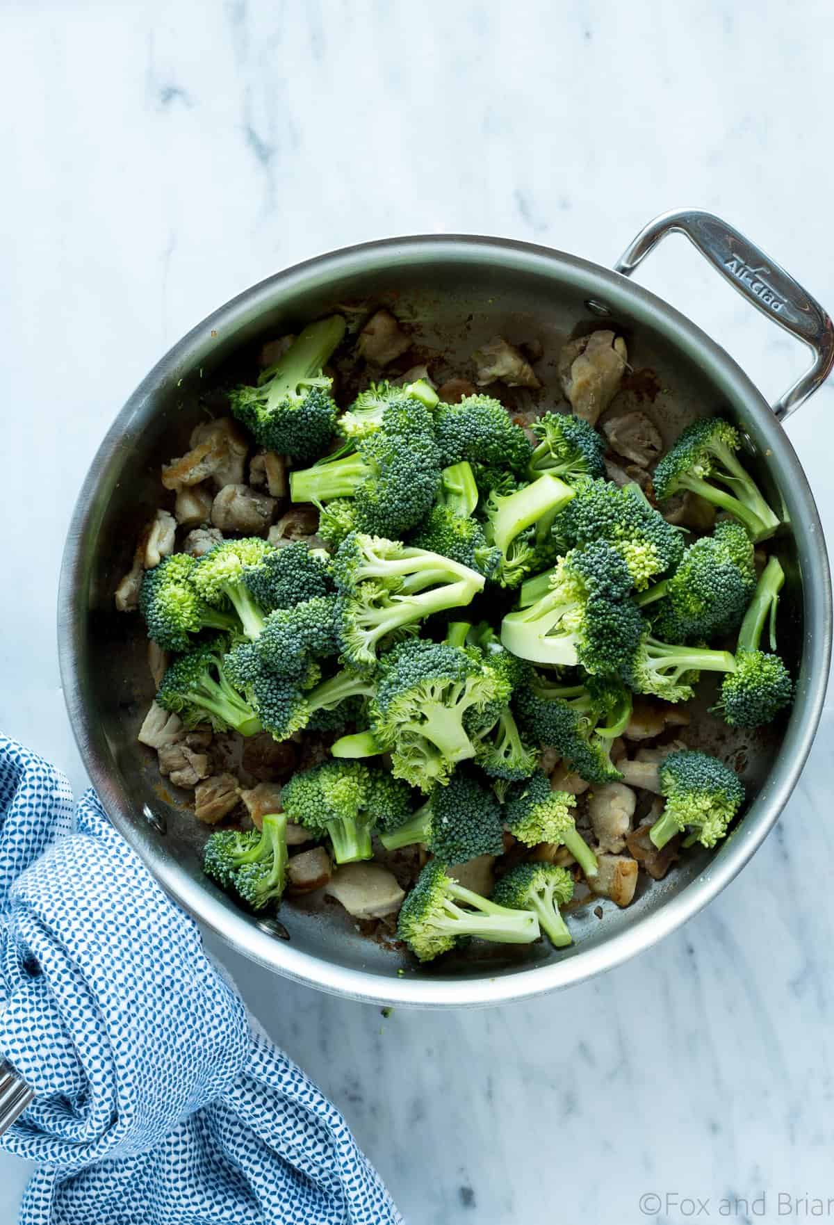 This Buffalo Chicken and Broccoli Bowl is fast, easy and flavorful. Chicken and broccoli in a buffalo sauce, served over cauliflower rice makes a gluten free, low carb, high protein, paleo and whole 30 friendly meal!