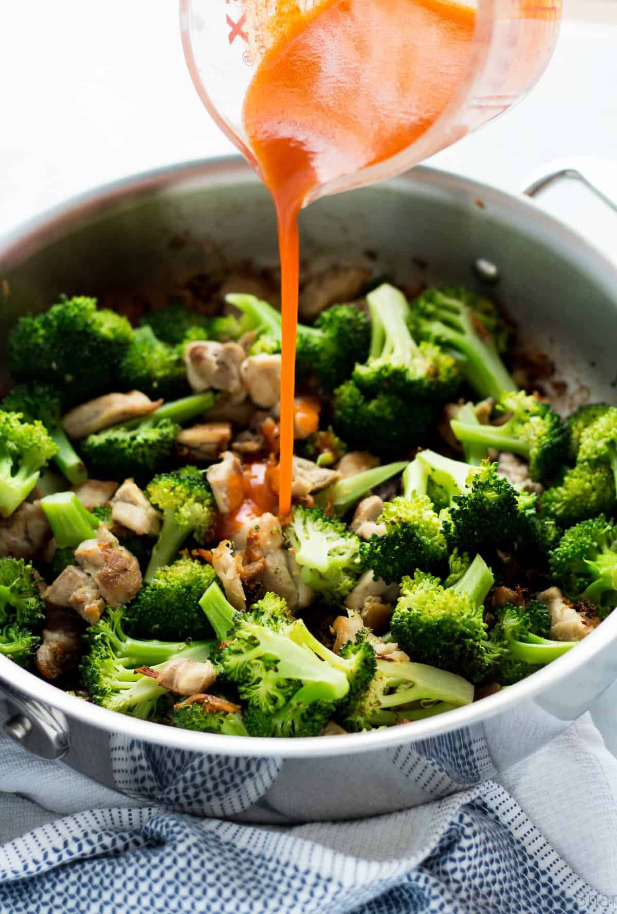 This Buffalo Chicken and Broccoli Bowl is fast, easy and flavorful. Chicken and broccoli in a buffalo sauce, served over cauliflower rice makes a gluten free, low carb, high protein, paleo and whole 30 friendly meal!