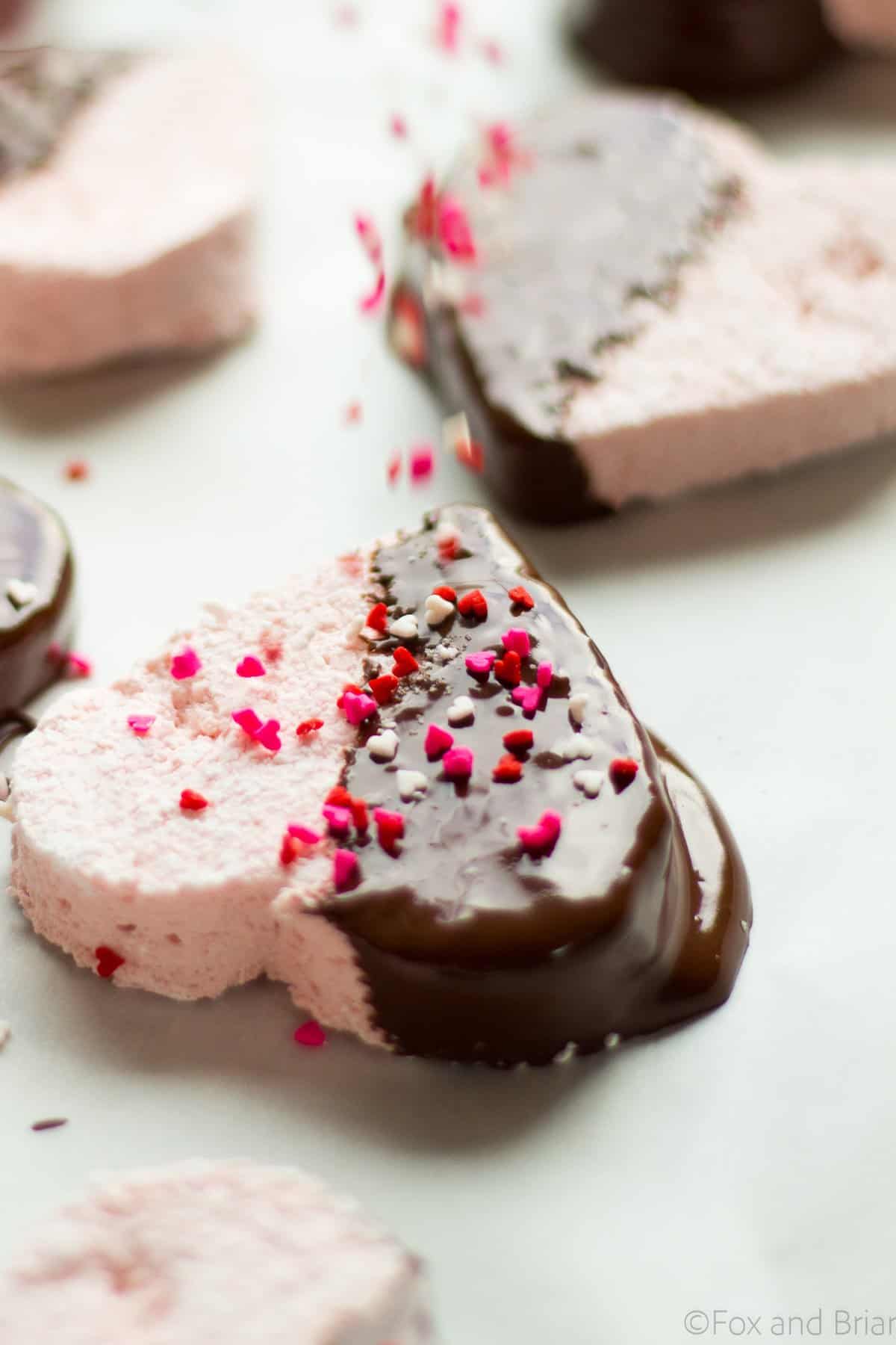 These Homemade Strawberry Marshmallows are fun and simple to make, and have amazing strawberry flavor. No high fructose corn syrup or dyes! A fun treat for Valentine's day or any other time of year!.