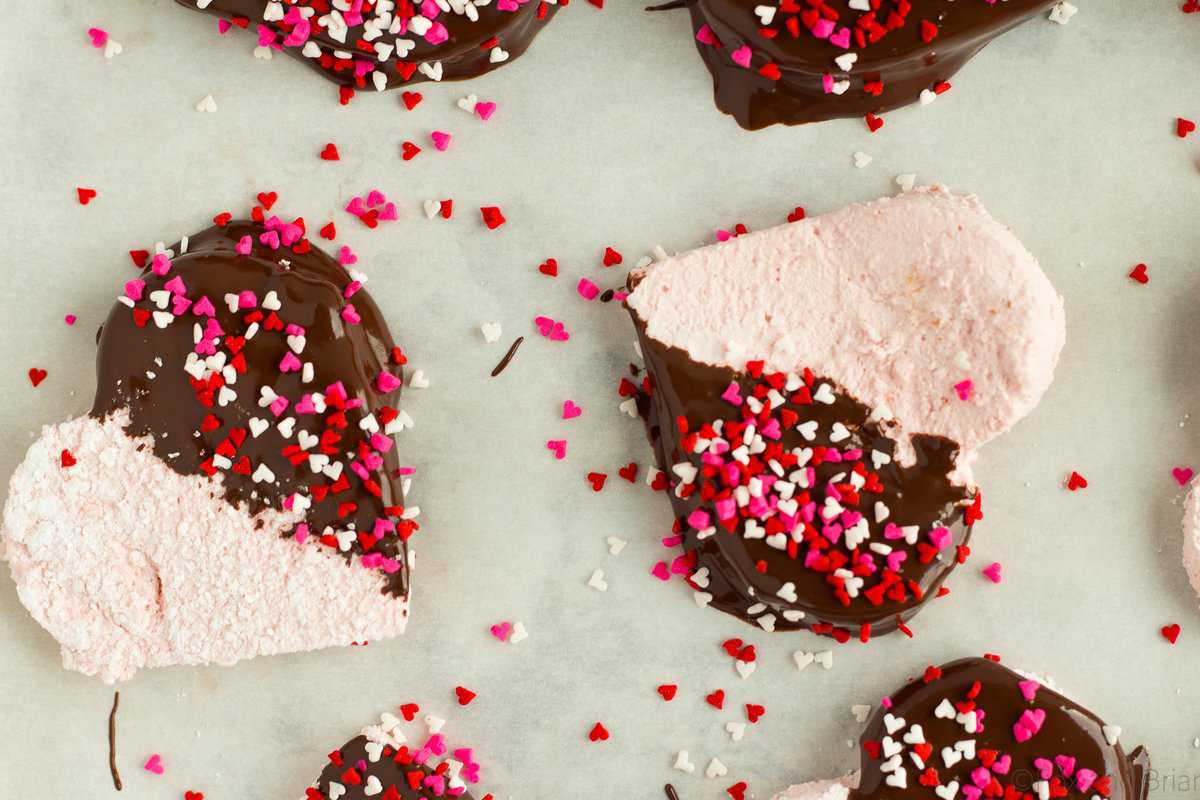 These Homemade Strawberry Marshmallows are fun and simple to make, and have amazing strawberry flavor. No high fructose corn syrup or dyes! A fun treat for Valentine's day or any other time of year!.