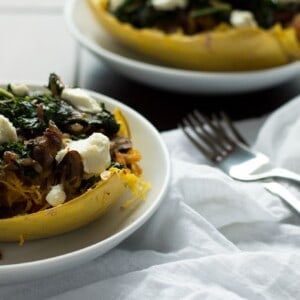 These veggie spaghetti squash boats are vegetarian, with kale, mushrooms and goat cheese. So packed with flavor and super healthy!