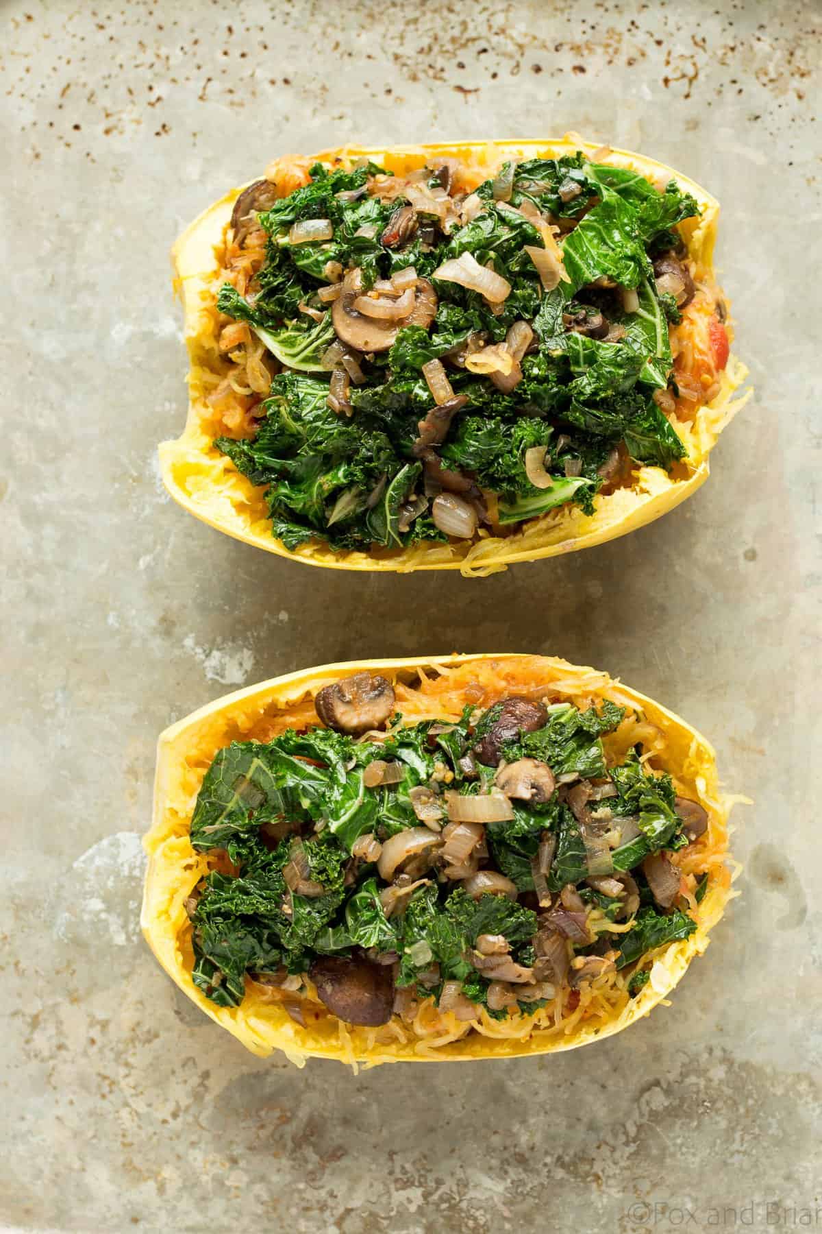 These veggie spaghetti squash boats are vegetarian, with kale, mushrooms and goat cheese. So packed with flavor and super healthy!