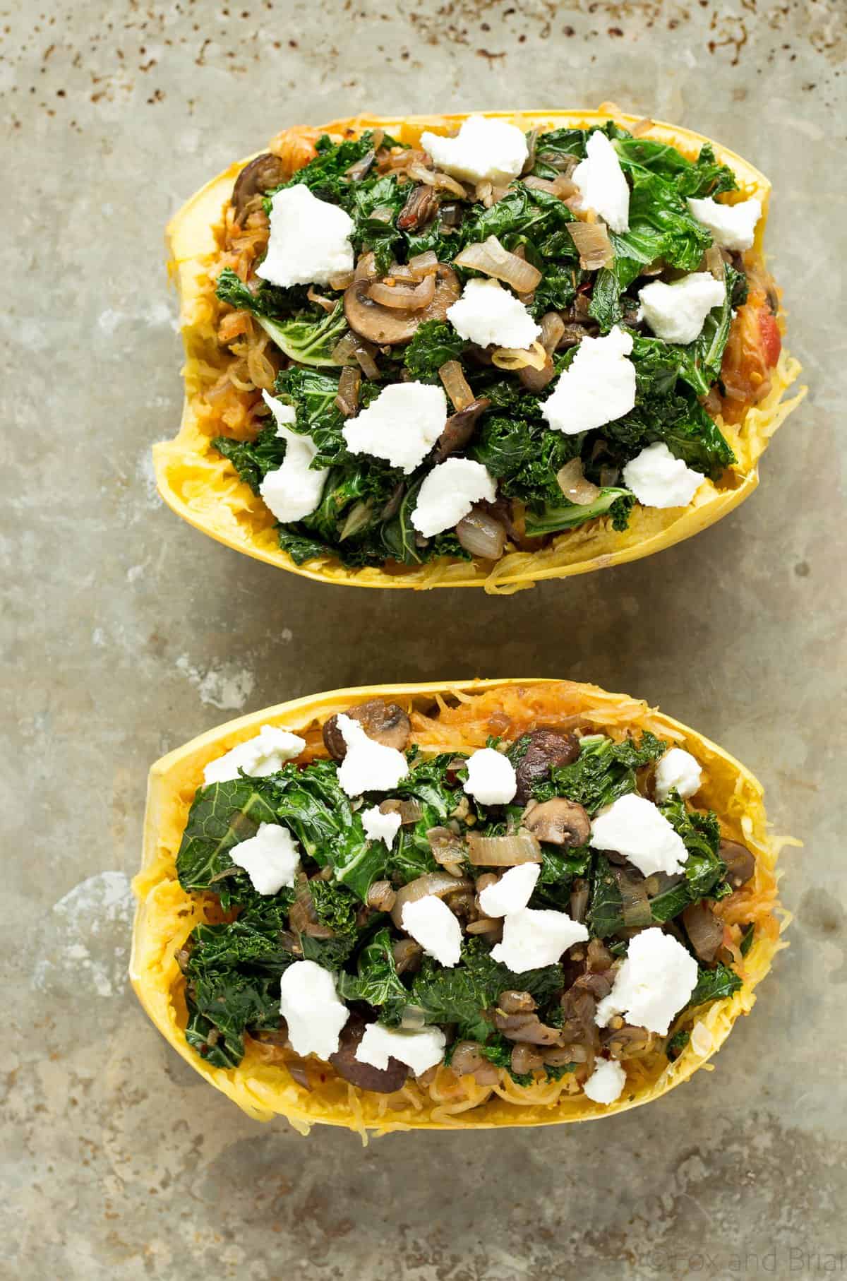 These veggie spaghetti squash boats are vegetarian, with kale, mushrooms and goat cheese. So packed with flavor and super healthy!