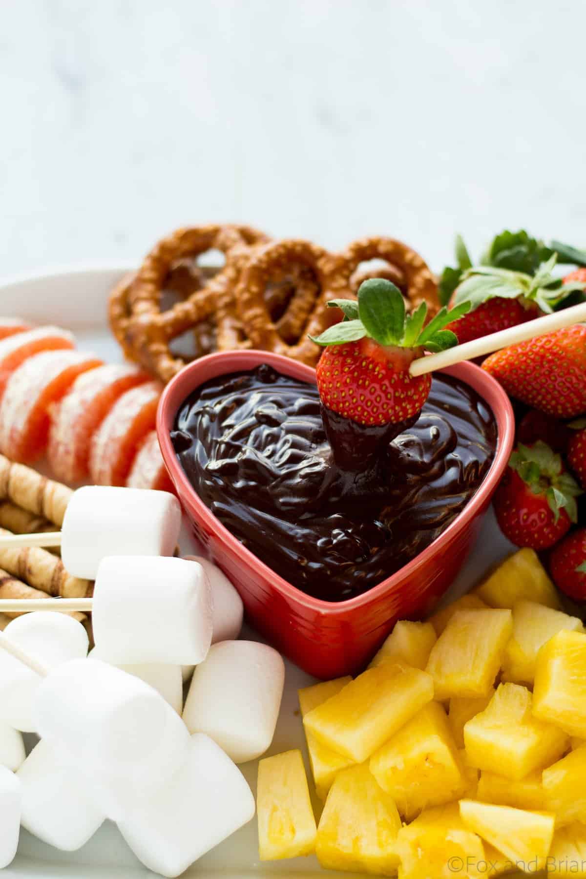 This easy chocolate fondue is a fun dessert for a romantic valentine's day dinner or party. It is rich and chocolaty and doesn't even require a fondue pot!