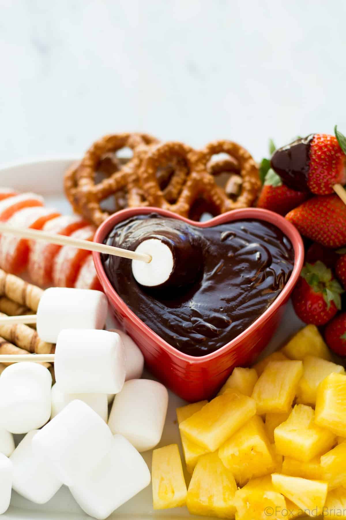 This easy chocolate fondue is a fun dessert for a romantic valentine's day dinner or party. It is rich and chocolaty and doesn't even require a fondue pot!