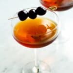 This classic Manhattan cocktail is classic for a reason! Rye whiskey, sweet vermouth plus a secret ingredient that gives a little twist on the original!