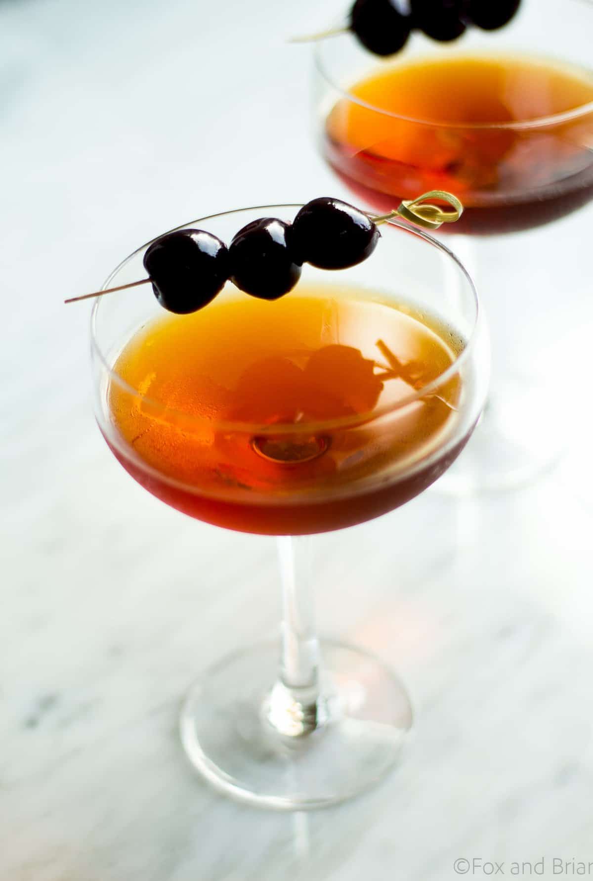 This classic Manhattan cocktail is classic for a reason! Rye whiskey, sweet vermouth plus a secret ingredient that gives a little twist on the original!