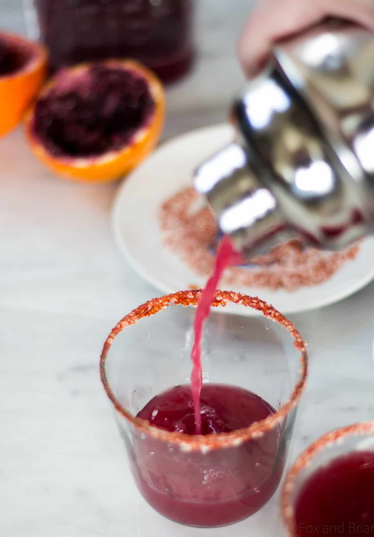 This Fresh Blood Orange Margarita has an optional smoky salted rim. The fresh citrus flavors of the blood orange make this a sweet and tart cocktail, and the smoked paprika salted rim gives it a little something extra.