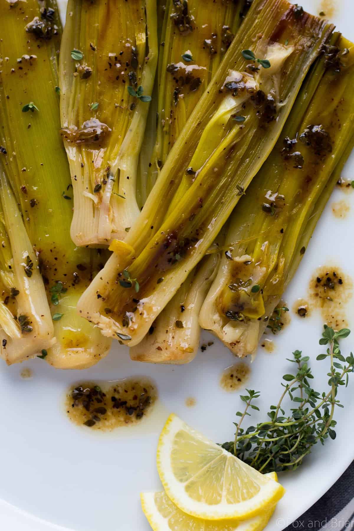 These Braised Leeks make the perfect spring side dish. They have a sweeter, more mild flavor than onions, and are caramelized before being cooked in a butter, white wine and lemon sauce. You and your guests won't be able to stop eating them!