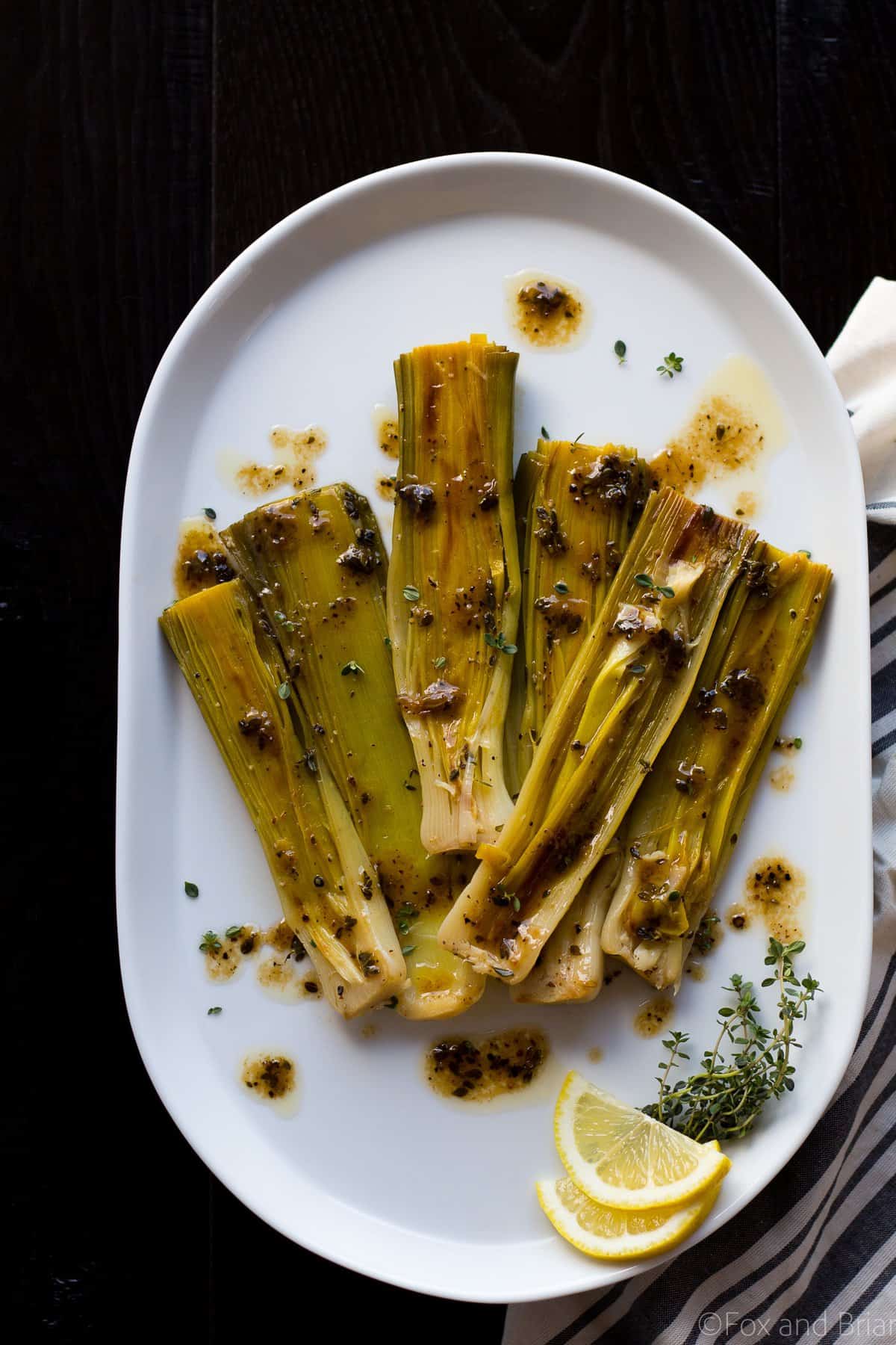 These Braised Leeks make the perfect spring side dish. They have a sweeter, more mild flavor than onions, and are caramelized before being cooked in a butter, white wine and lemon sauce. You and your guests won't be able to stop eating them!