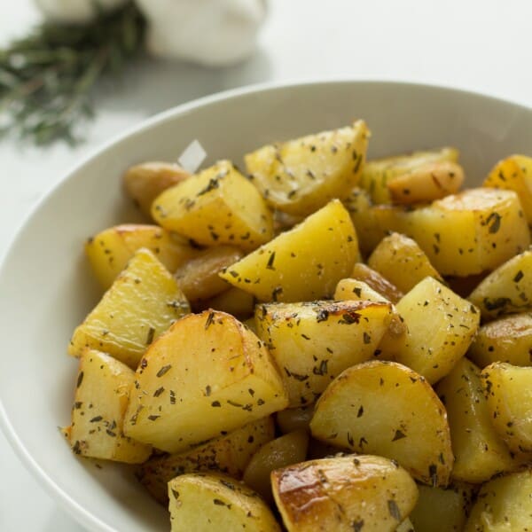 Golden potatoes roasted with garlic and rosemary are your perfect side dish.