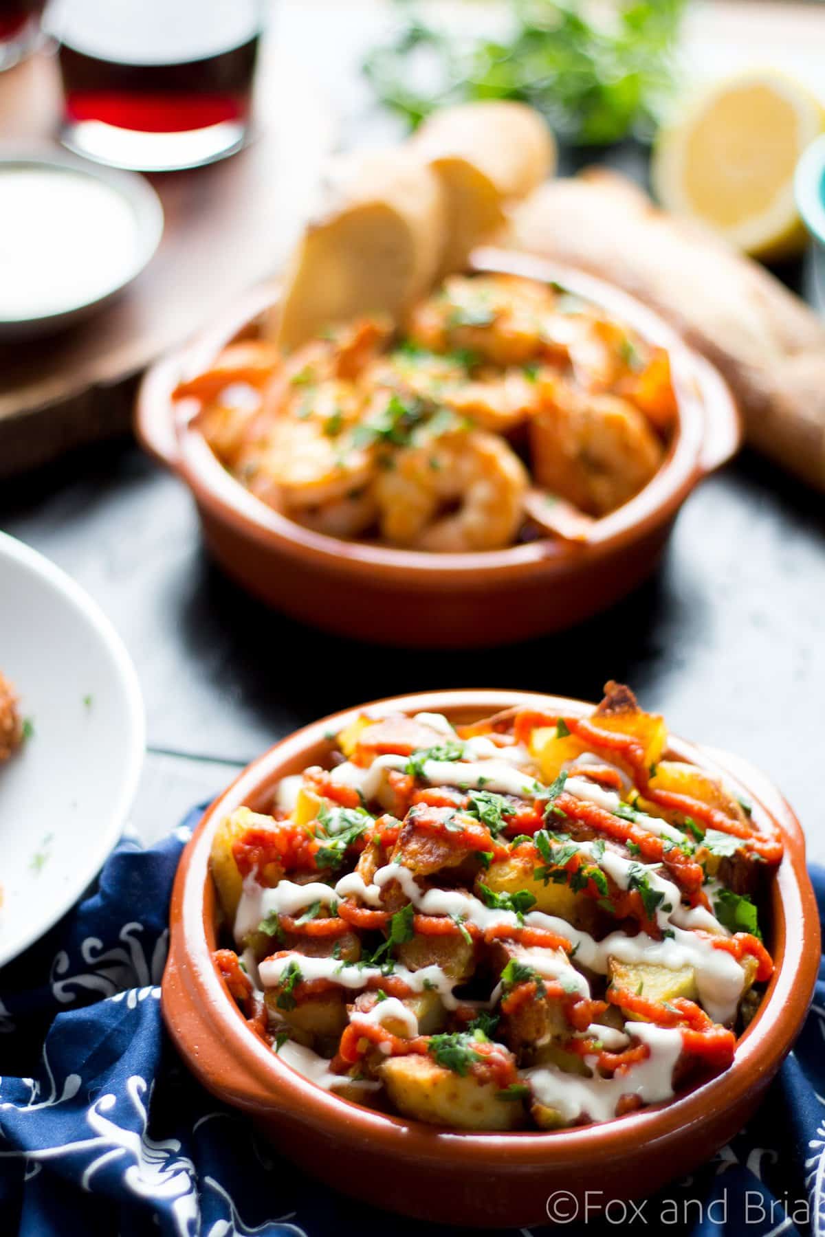 These patatas bravas are crispy even though they are baked not fried! Topped with a delicious smoky salsa brava and garlic aioli, they are totally addictive!