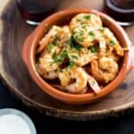 Garlic Shrimp (Gambas al Ajillo) are a classic Spanish tapas dish. Succulent shrimp in a spicy garlicky sauce that you will need to dip your bread into!