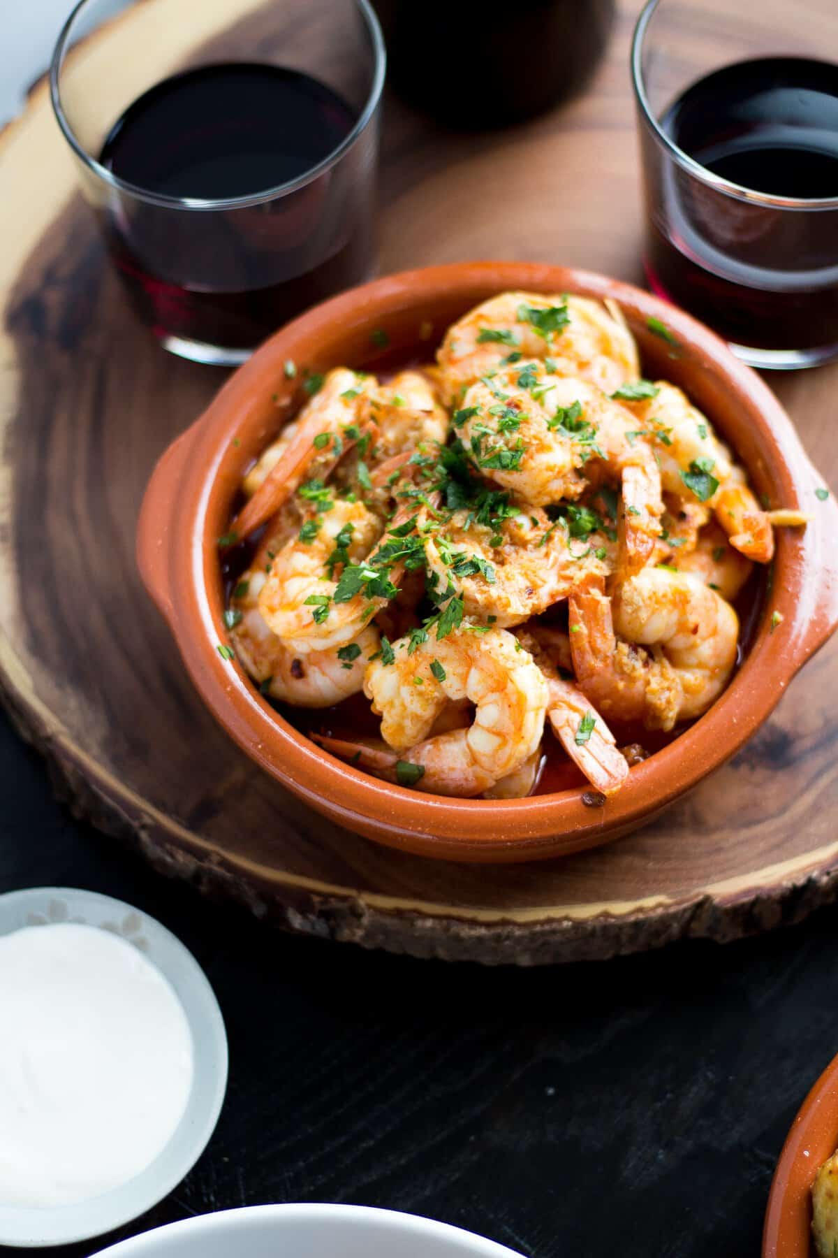 Garlic Shrimp (Gambas al Ajillo) are a classic Spanish tapas dish. Succulent shrimp in a spicy garlicky sauce that you will need to dip your bread into!