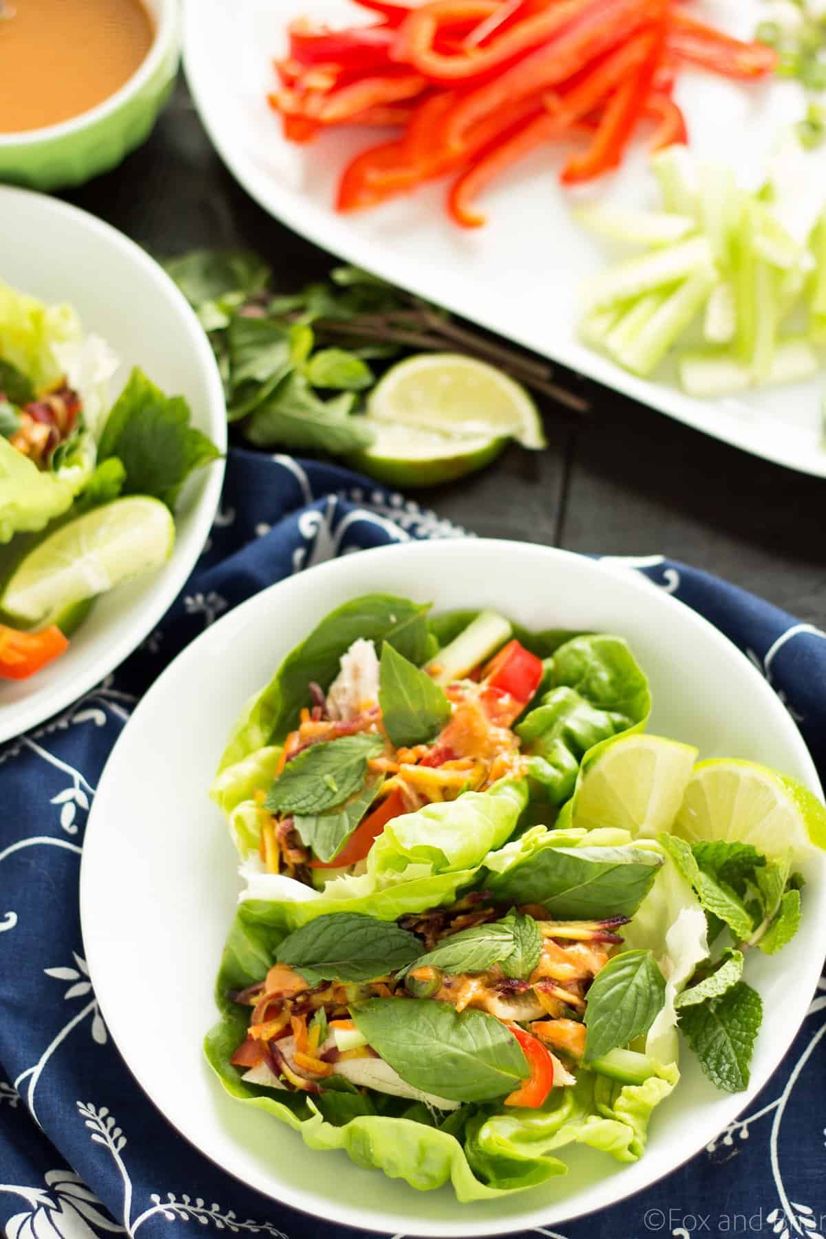 These Ginger peanut lettuce wraps are filled with colorful veggies, your protein of choice, and the most addictive peanut sauce ever!