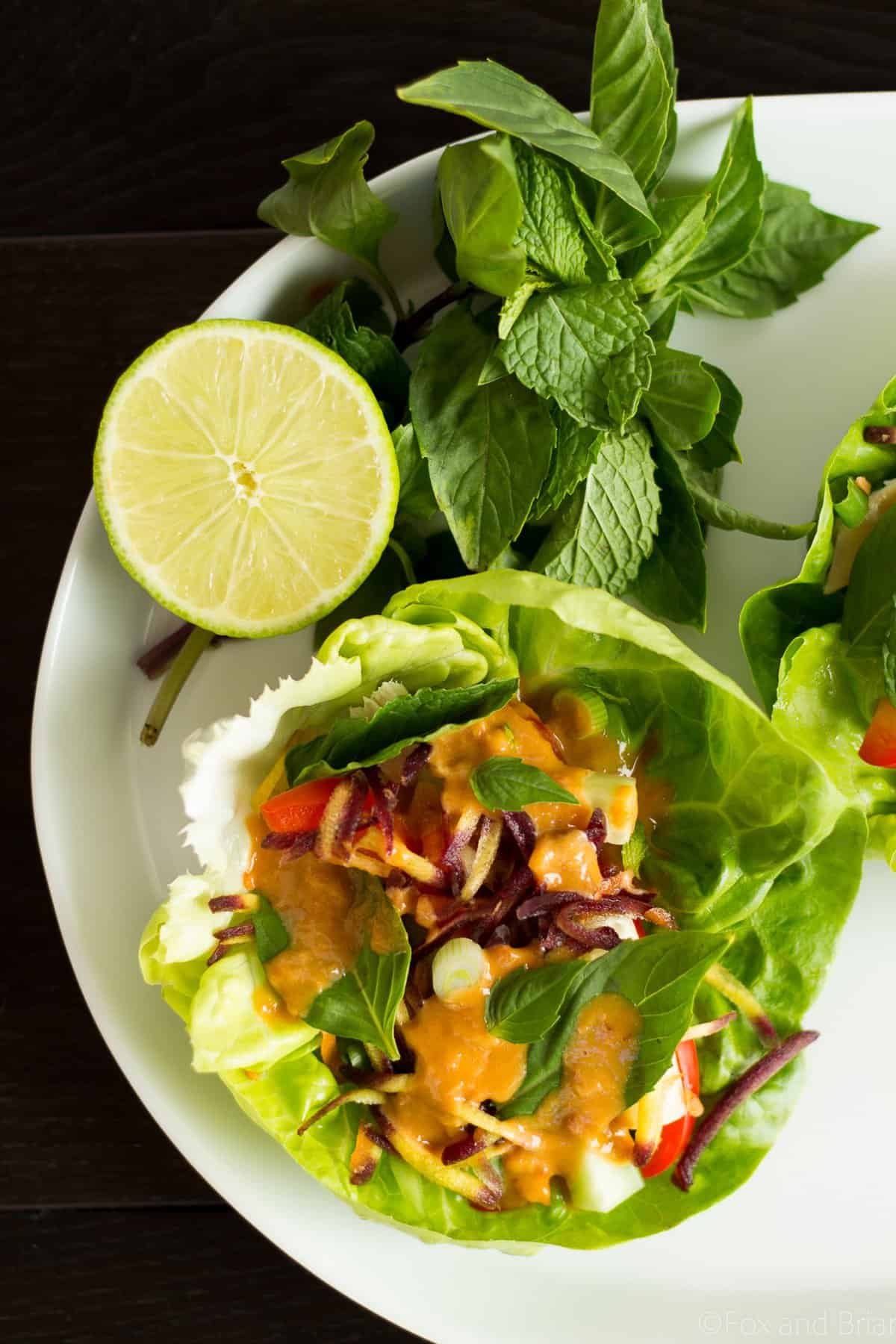 These Ginger peanut lettuce wraps are filled with colorful veggies, your protein of choice, and the most addictive peanut sauce ever!