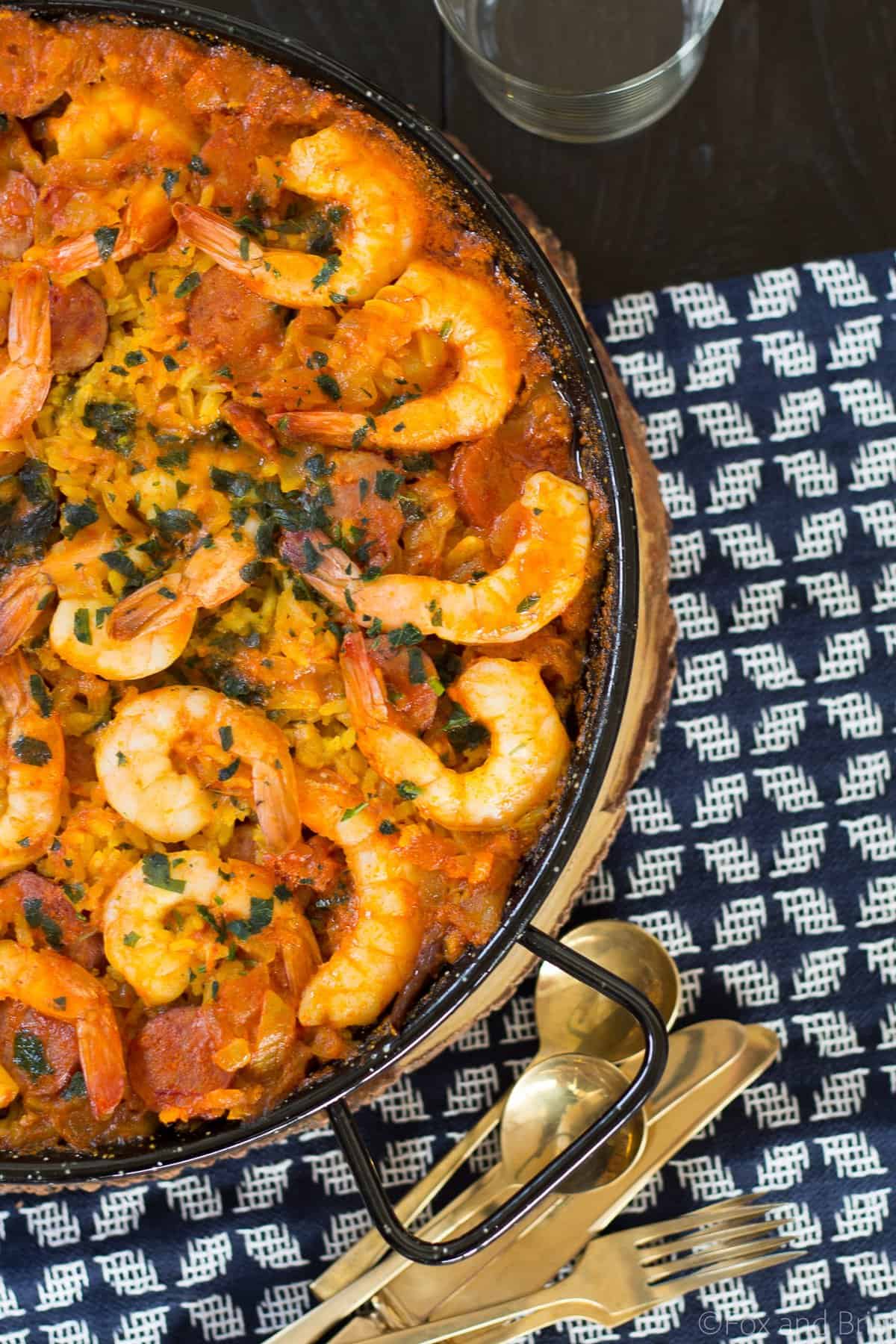 This spanish dish Paella is easy to make, has classic Spanish paella ingredients and is an impressive crowd pleaser.