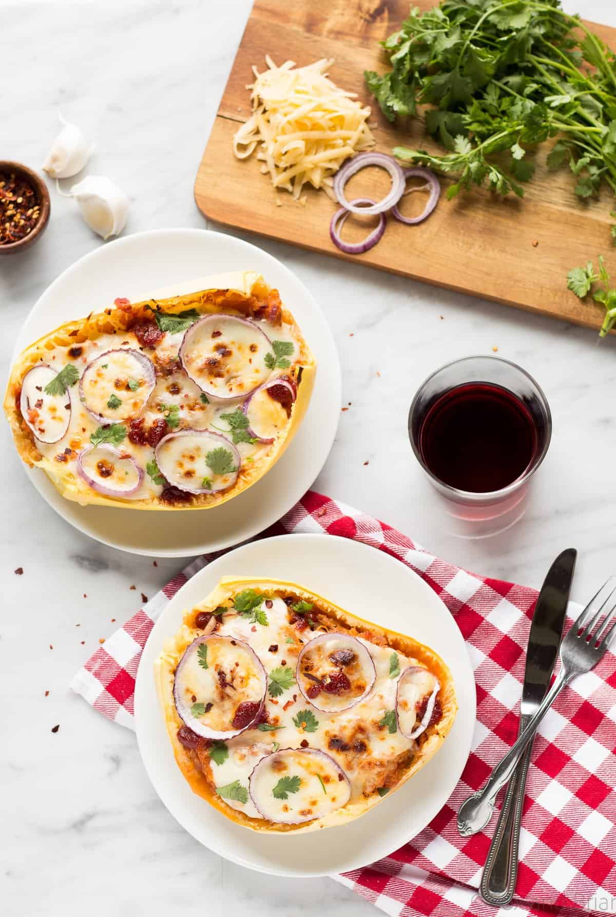 These BBQ Chicken Pizza Spaghetti Squash boats have all the delicious flavors of a BBQ Chicken Pizza - sweet and savory BBQ chicken, red onions and two kinds of cheese, stuffed in a spaghetti squash boat!