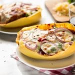 These BBQ Chicken Pizza Spaghetti Squash boats have all the delicious flavors of a BBQ Chicken Pizza - sweet and savory BBQ chicken, red onions and two kinds of cheese, stuffed in a spaghetti squash boat!