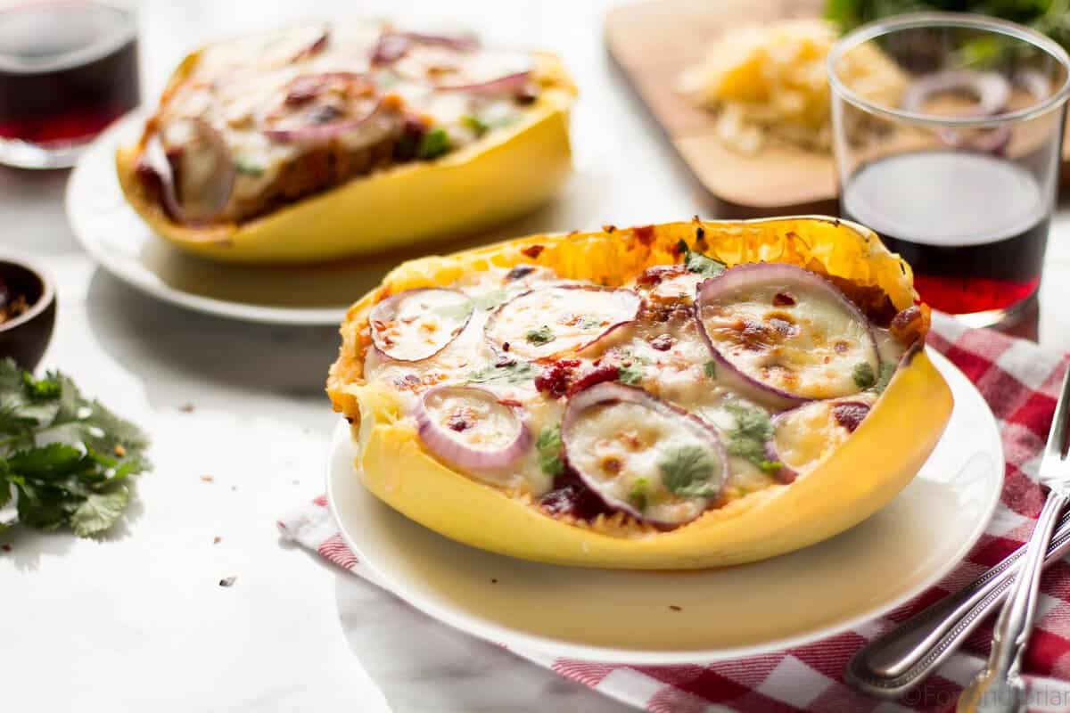 These BBQ Chicken Pizza Spaghetti Squash boats have all the delicious flavors of a BBQ Chicken Pizza - sweet and savory BBQ chicken, red onions and two kinds of cheese, stuffed in a spaghetti squash boat!