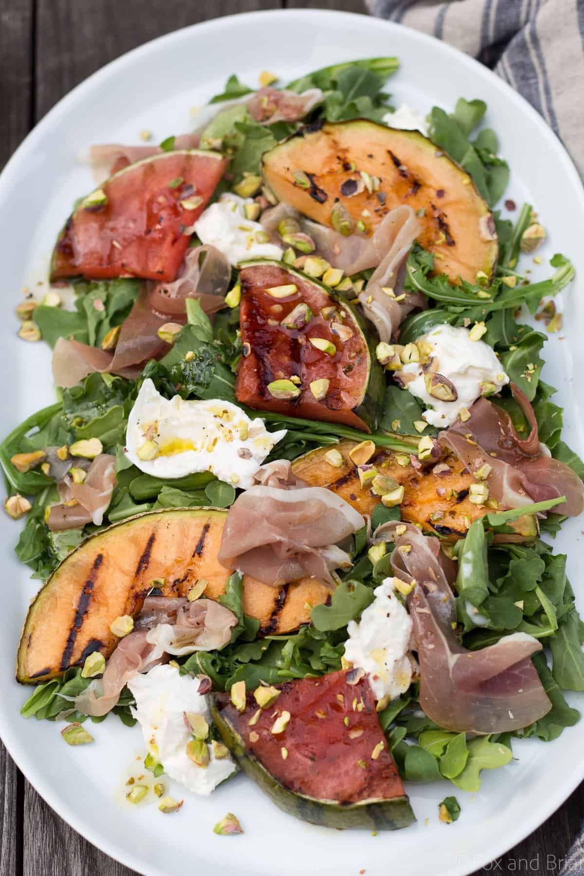 This Grilled Melon Salad with Prosciutto and Burrata is a light dinner perfect for a hot summer day!