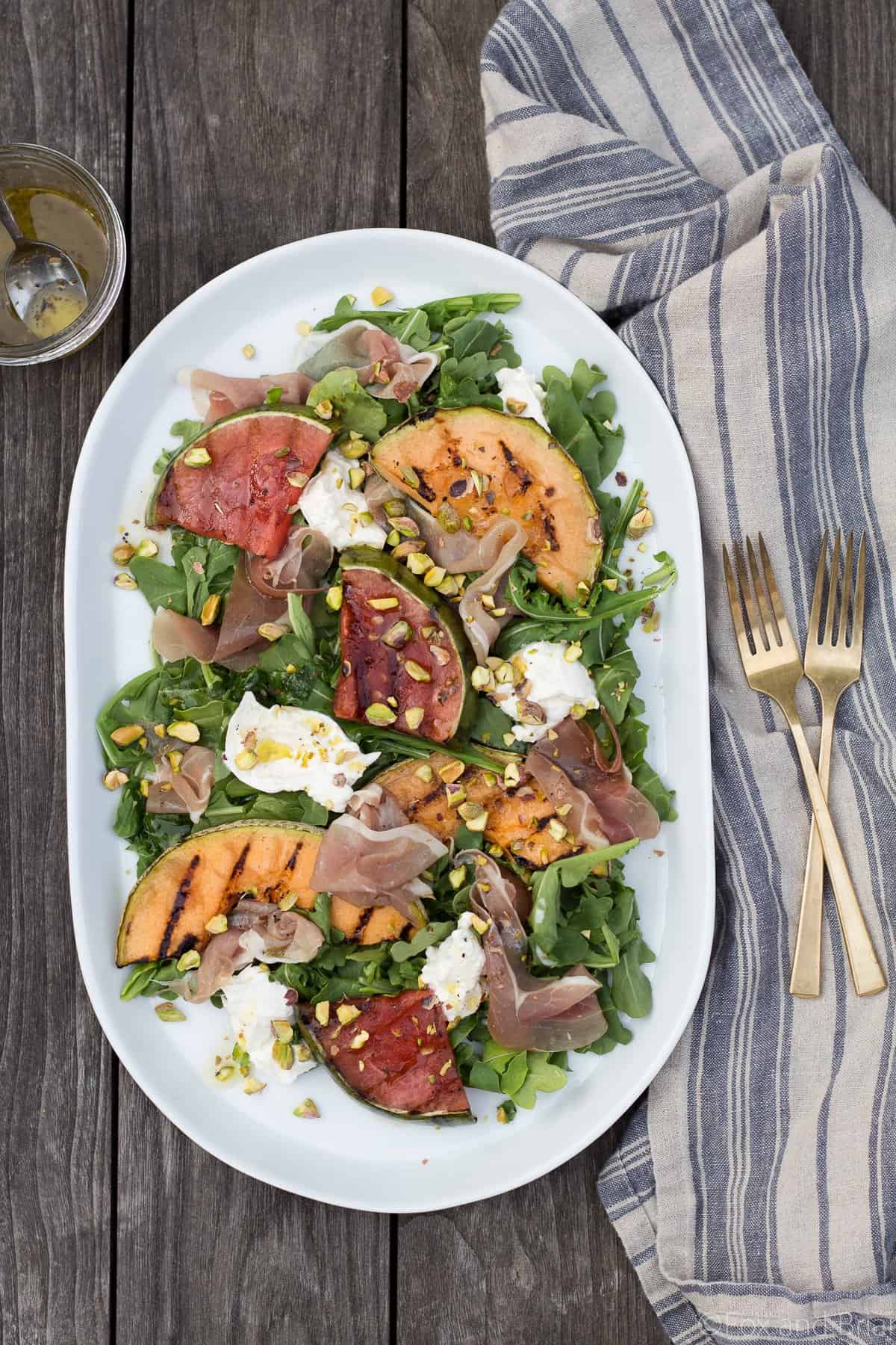 This Grilled Melon Salad with Prosciutto and Burrata is a light dinner perfect for a hot summer day!