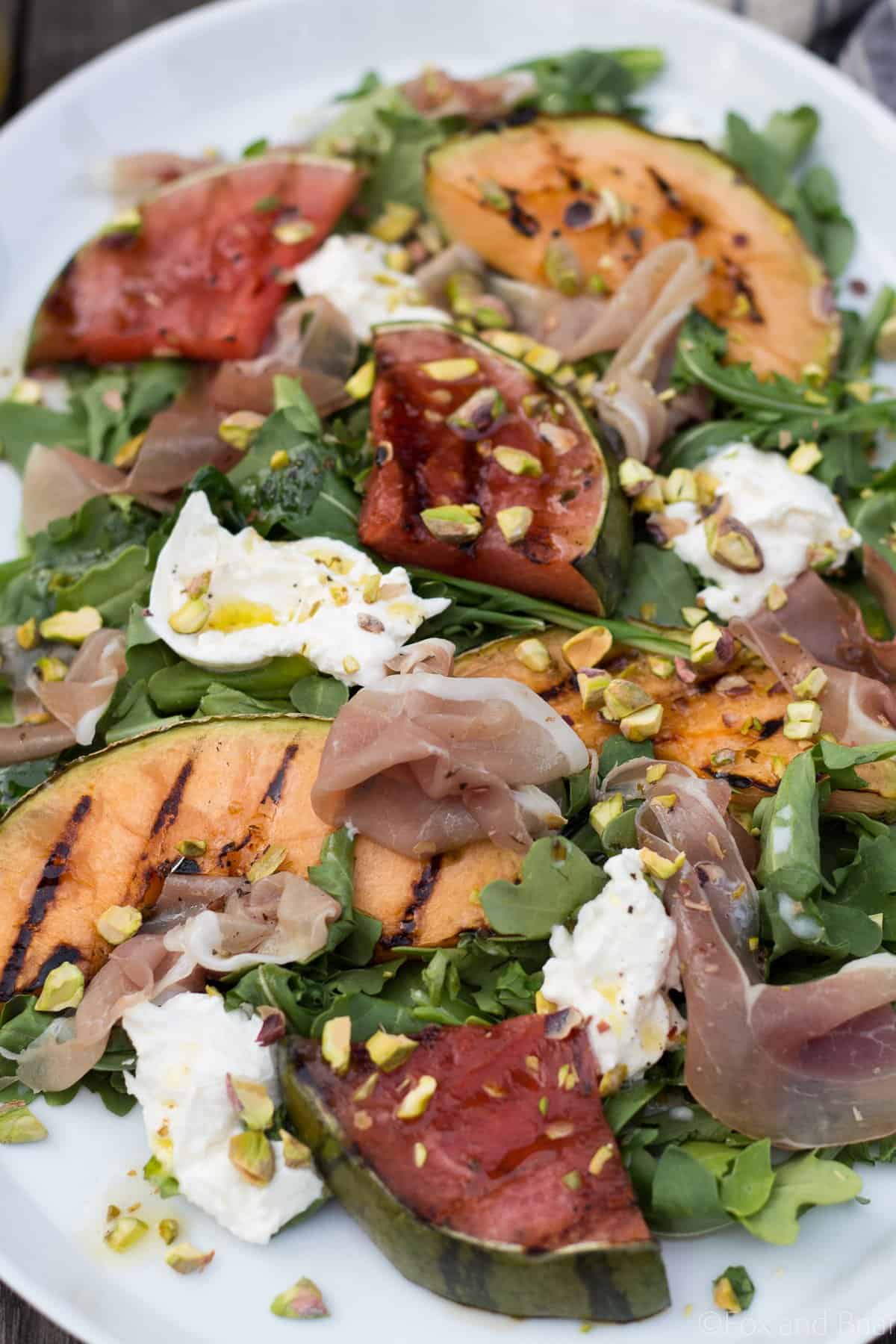 This Grilled Melon Salad with Prosciutto and Burrata is a light dinner perfect for a hot summer day!